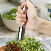 Thumb press pepper grinder