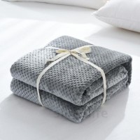 Super Soft and Breathable Coral Fleece Blanket with Honeycomb Design.